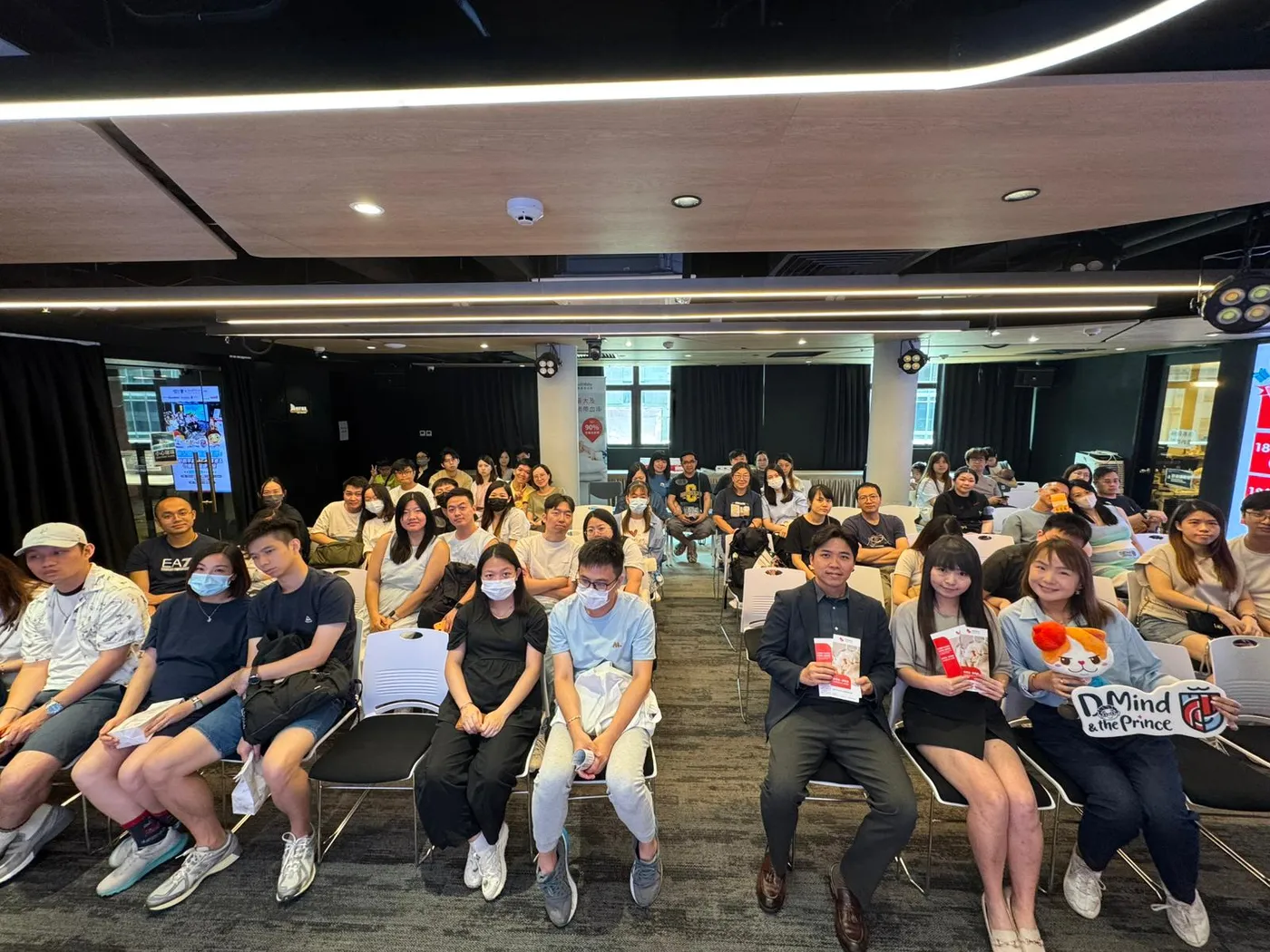 Parents and young children gathered at a parenting seminar.